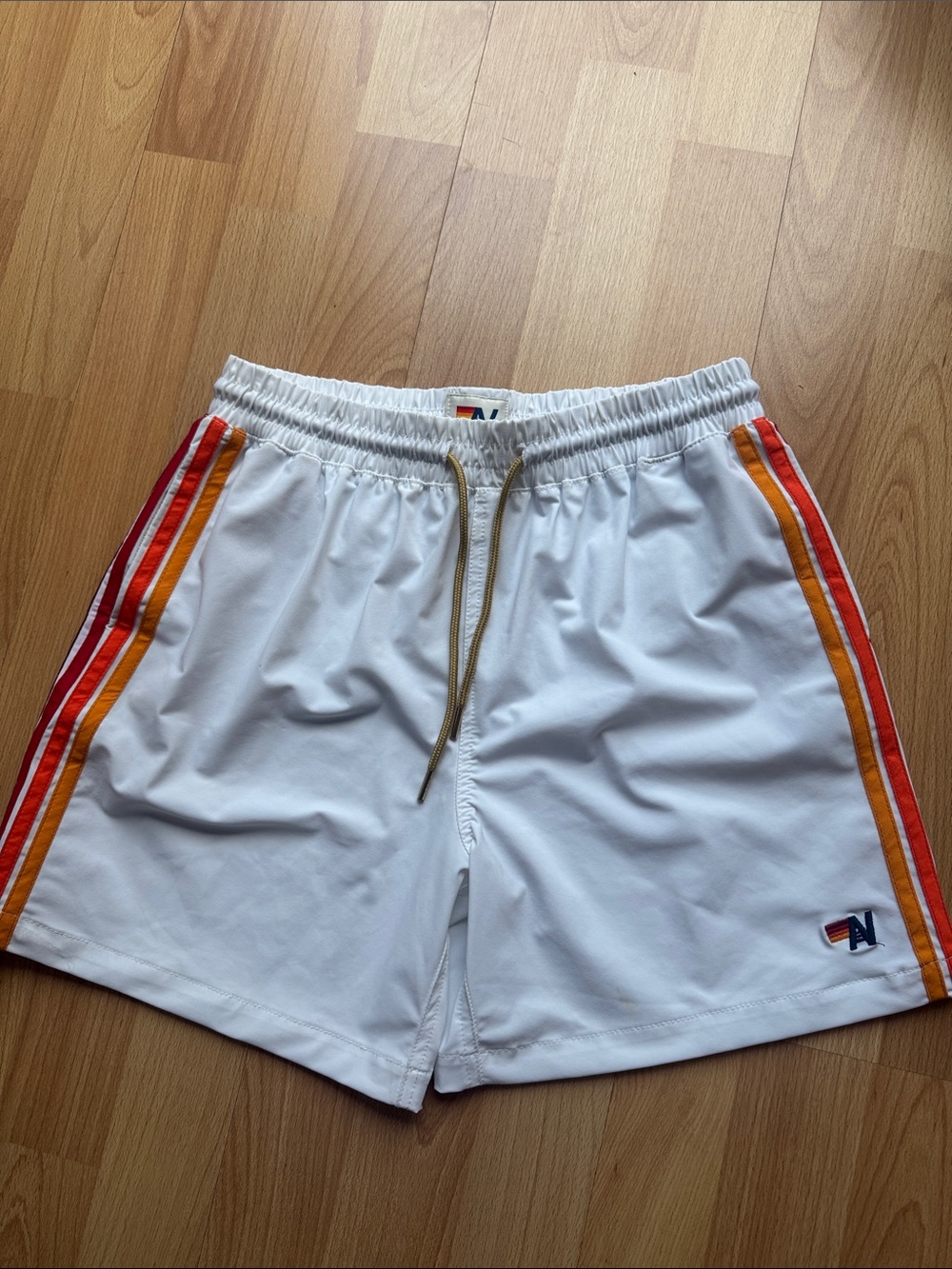 White Athletic Shorts with Red & Orange Side Stripes